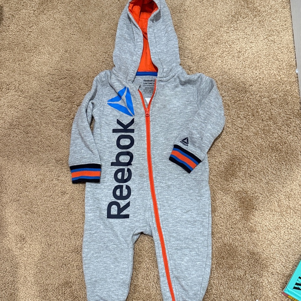 Reebok Kids One Piece in Gray with Orange Accents